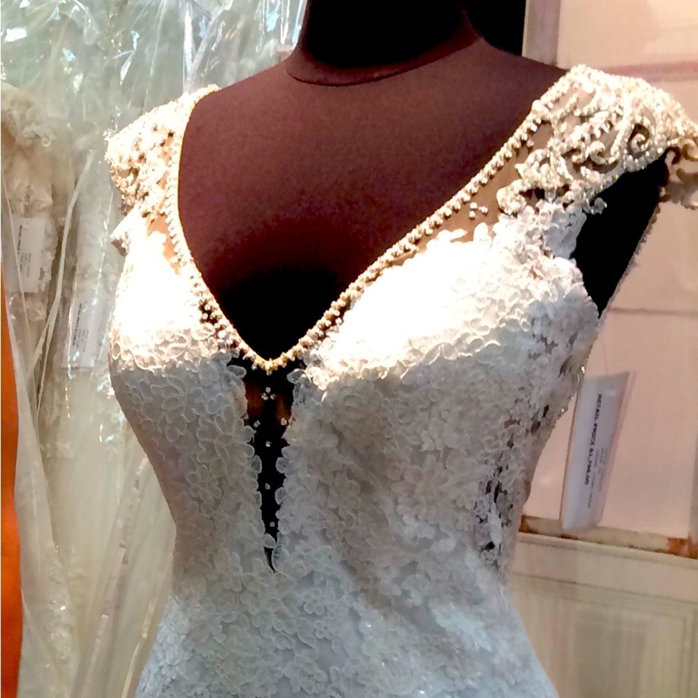 Casablanca wedding dress. professionally cleaned and vacuumed sealed in box.